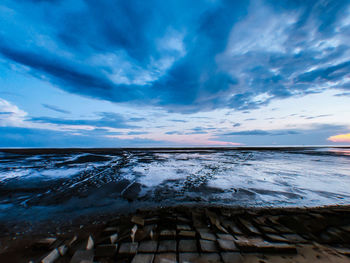 Scenic view of sea against sky during winter