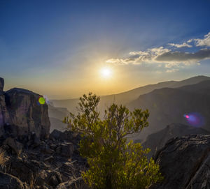 Scenic view of mountains against sky during sunset