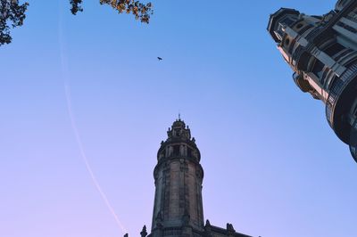 Low angle view of building against clear blue sky