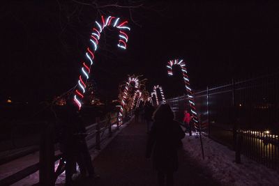 Low angle view of firework display at night