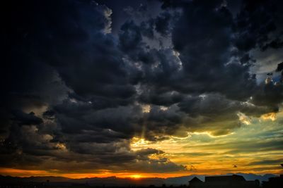 Low angle view of dramatic sky during sunset