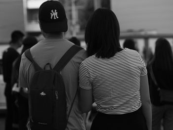 Rear view of people walking outdoors