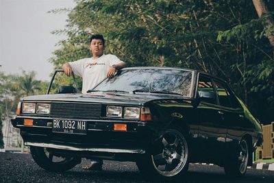 Side view of a smiling man in car