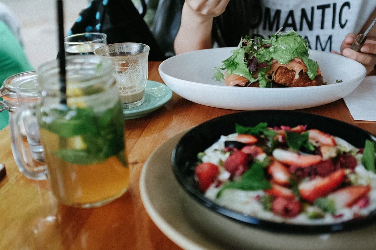 food and drink, indoors, food, freshness, table, ready-to-eat, plate, drinking glass, drink, healthy eating, meal, refreshment, still life, restaurant, serving size, close-up, bowl, salad, indulgence, one person