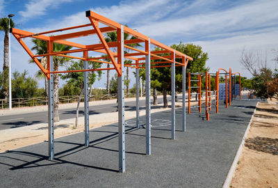 View of playground against blue sky