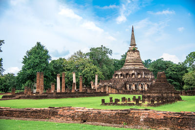 View of temple building against cloudy sky