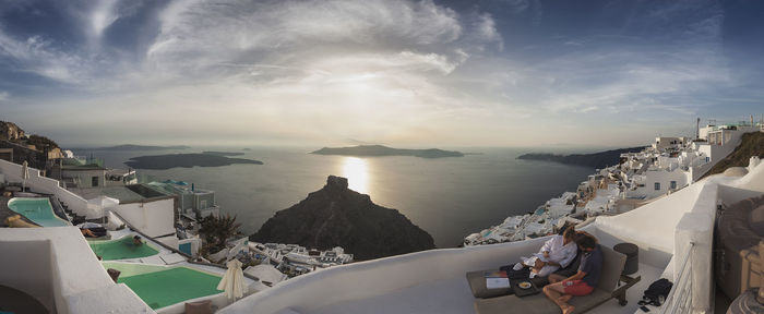 Panoramic view of sea and buildings against sky