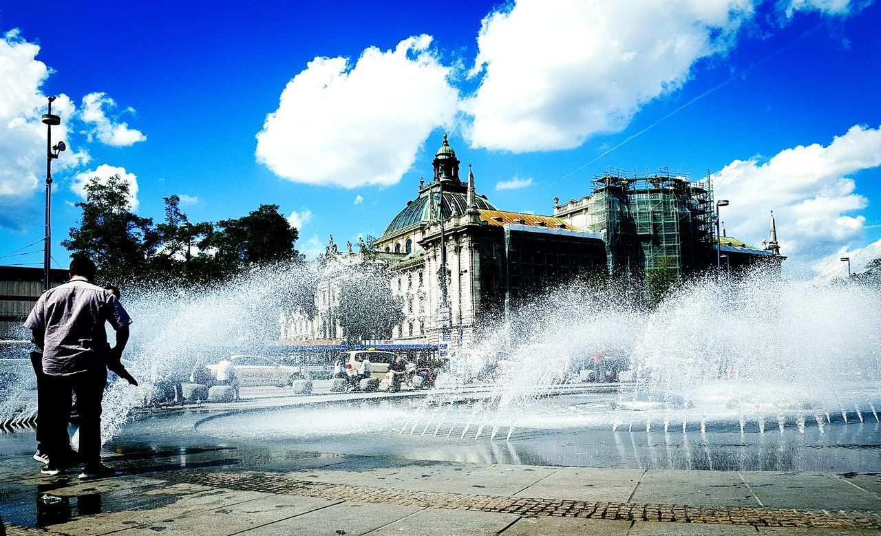 WATER SPLASHING IN FOUNTAIN AGAINST SKY