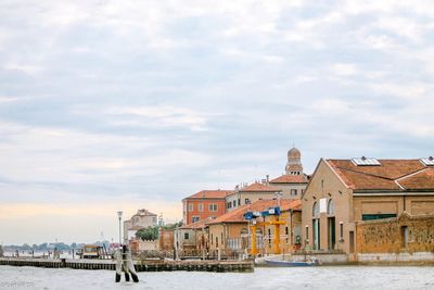 View of venice waterfront against cloudy sky