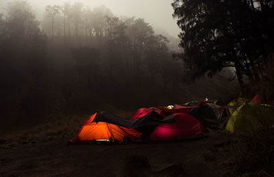 Tent on field during foggy weather