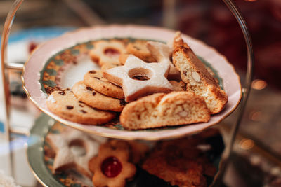 Tasty sweet cookies with almond on a plate. delicious dessert in a cafe