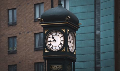 Low angle view of clock on building