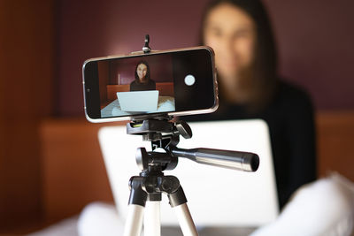 Close-up of woman using mobile phone