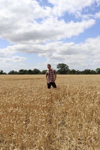 Man on field against sky