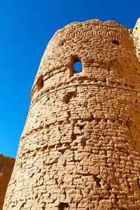 Low angle view of building against blue sky