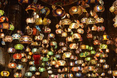 Low angle view of illuminated lanterns for sale in market