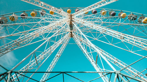 Low angle view of ferris wheel against sky