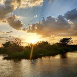 Scenic view of lake against sky during sunset