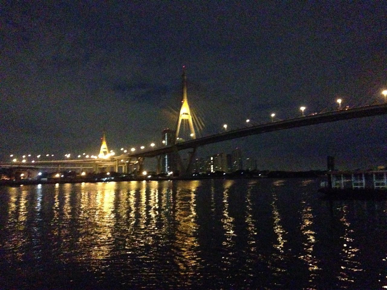 reflection, night, water, illuminated, waterfront, built structure, architecture, building exterior, lake, river, city, standing water, tree, outdoors, pond, canal, no people, silhouette, street light, nature