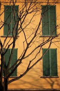 Low angle view of built structure at sunset