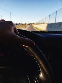 Cropped image of car on road