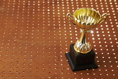 High angle view of trophy on table