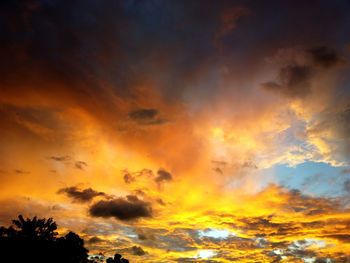 Low angle view of dramatic sky during sunset