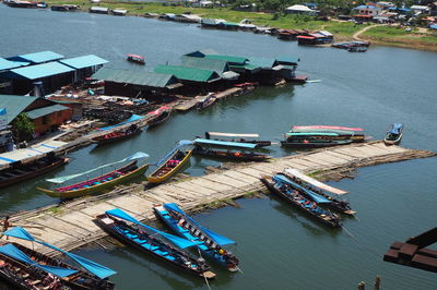 High angle view of boats moored at harbor