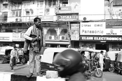 People walking on street in city