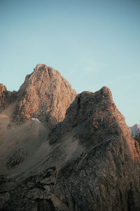 Rock formations on landscape against clear sky