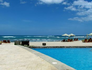 Scenic view of calm sea against blue sky