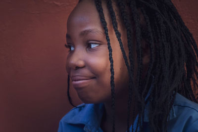 Portrait of a beautiful young woman looking away