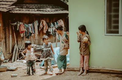 People standing against wall