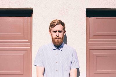 Man standing between two doors