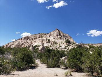 Low angle view of rocky mountain against sky