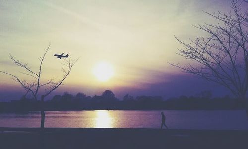 Scenic view of lake at sunset