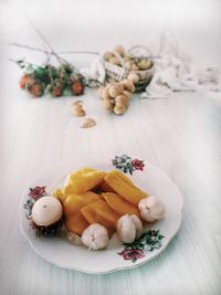 High angle view of fruits in plate on table