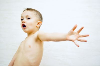 Shirtless boy in water