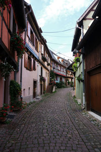 Footpath amidst buildings in town