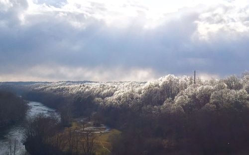 Scenic view of mountains against cloudy sky