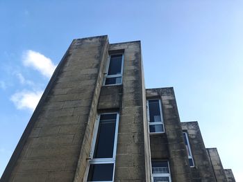 Low angle view of building against blue sky