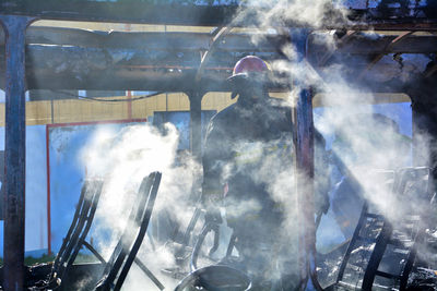 Digital composite image of smoke from window