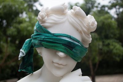 Close-up of statue with scarf