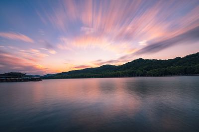 Scenic view of lake against sky during sunset