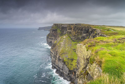 Dramatic storm sky over iconic cliffs of moher, ireland