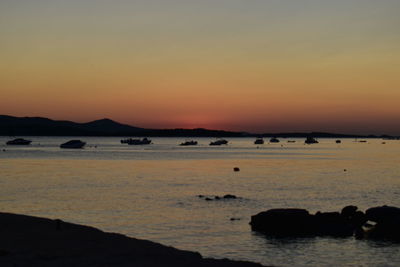 Scenic view of sea against clear sky during sunset