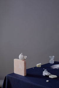 Close-up of objects on table against gray background