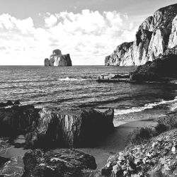 Scenic view of sea against cloudy sky