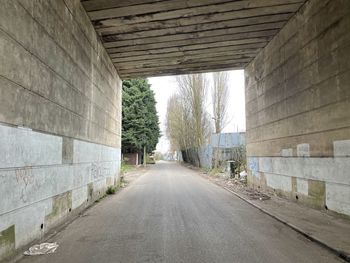 Empty road along walls