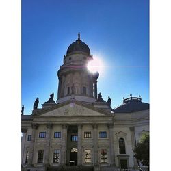 Low angle view of building against blue sky